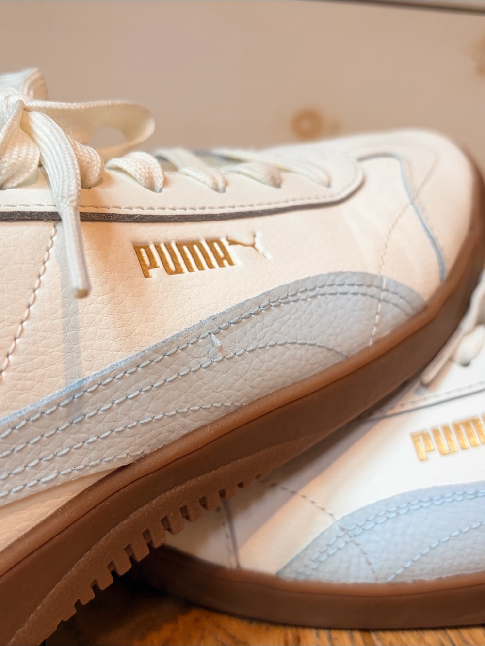Puma 5V5 creamy White Sneakers with Light Blue Accents and Gold Logo